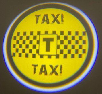 Логод на батарейках TAXI. Бездротове лого дверцята-Таксі. Lazer door logo. TAXI&mdash;безпровідне лого фото