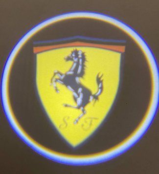 Логод на батарейках Ferrari. Бездротове лого дверцята-Ферарі. Lazer door logo. Ferrari&mdash;безпровідне лого фото