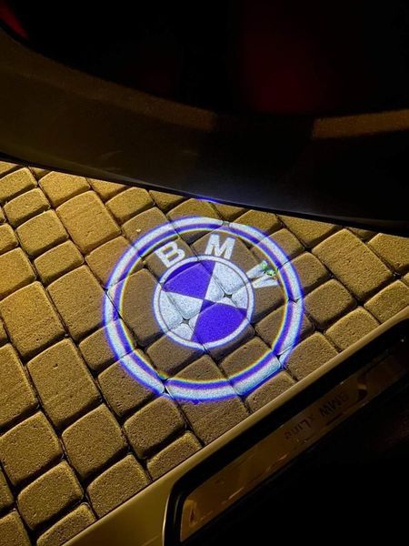Логотип підсвітка дверей БМВ Lazer door logo light BMW Е60 Е65 Е70 Е90 F10 01 BMW Е60 Е70 Е90 F10 фото